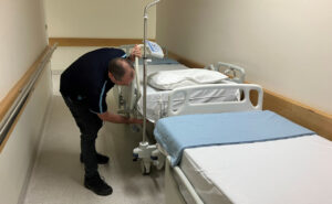 Technician working on medical bed